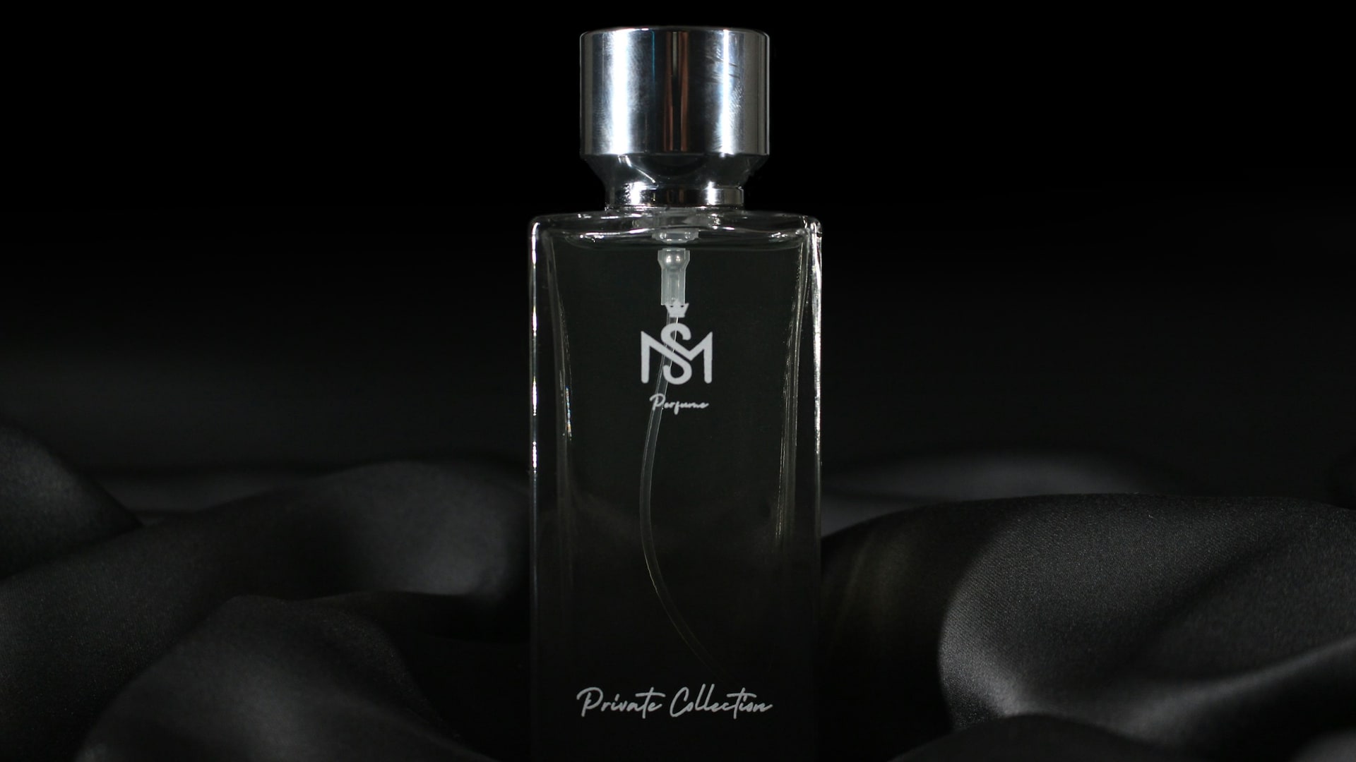 Luxury perfume bottle in cinematic dark fragrance lighting for Naseem Al Haya