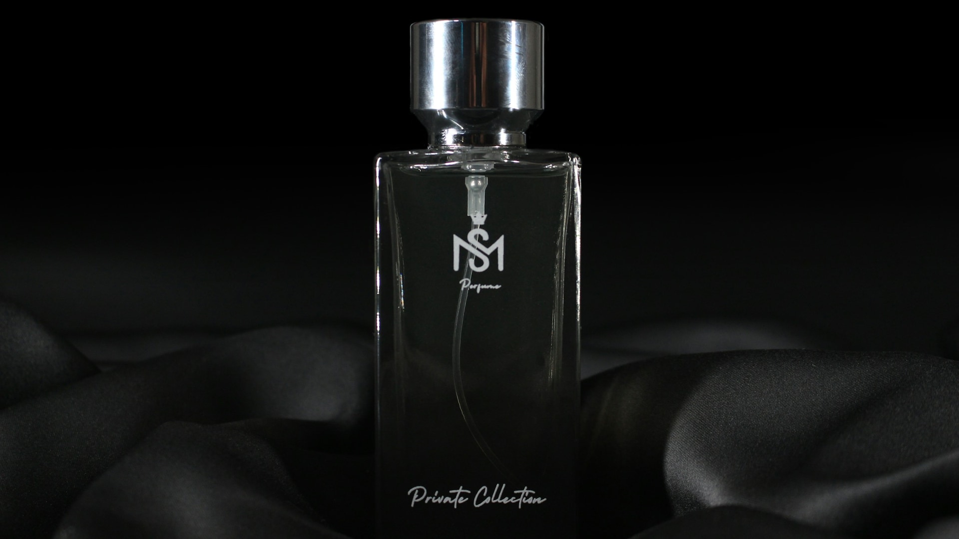 Luxury perfume bottle in cinematic dark fragrance lighting for Naseem Al Haya